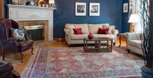 Maryland home living room with blue walls and a beautiful patterned area rug